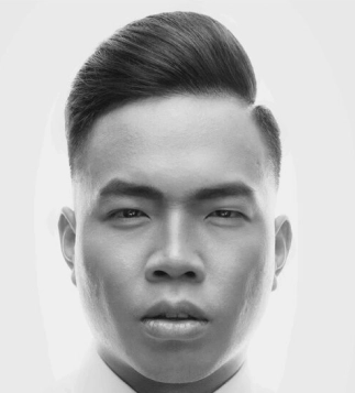 Modern men’s haircut with clean side part styled by Eddine Belaid – Professional grooming and precision hairstyling in Switzerland