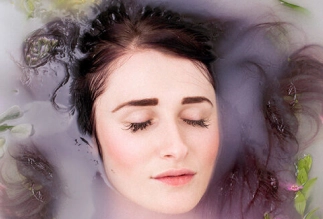 Relaxing beauty concept with woman immersed in floral water – Symbolizing natural care and rejuvenation at Eddine Belaid salon