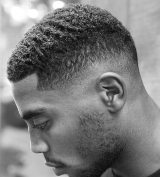 Textured fade haircut styled by Eddine Belaid – Modern men’s grooming with precision and detail in Switzerland