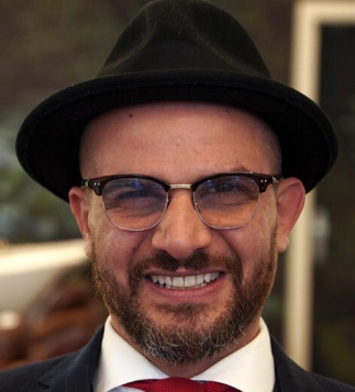 Eddine Belaid portrait – Renowned hairstylist and salon founder known for creativity, leadership, and luxury hair expertise in Switzerland