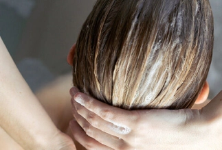 Professional hair treatment being applied at Eddine Belaid salon – Nourishing and restorative care for healthy, shiny hair