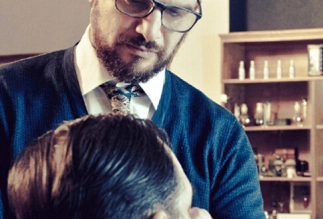 Eddine Belaid styling a male client – Precision men’s grooming and expert hairstyling at luxury salon in Switzerland