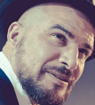 Close-up artistic portrait of Eddine Belaid – Visionary hairstylist known for creativity, innovation, and mastery in hair design