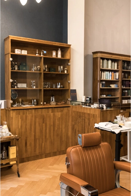 Eddine Belaid – The Barber interior featuring classic leather chairs and luxury grooming setup for men’s haircuts and shaves in Switzerland